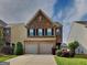 Charming two-story brick home with a two-car garage, neat landscaping, and a well-maintained front yard at 3741 Upland Dr, Mcdonough, GA 30253
