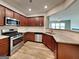 Modern kitchen showcasing stainless steel appliances, granite countertops, and wooden cabinetry at 3741 Upland Dr, Mcdonough, GA 30253
