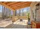 Inviting covered deck with wood finishes offers a cozy outdoor living space for relaxation and entertaining at 104 Pine Pt, Peachtree City, GA 30269