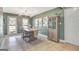 Charming dining room with stylish chandelier, neutral decor, and hardwood floors at 104 Pine Pt, Peachtree City, GA 30269
