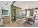 Beautiful dining room adjacent to an open floor plan, showcasing stylish decor and natural light at 104 Pine Pt, Peachtree City, GA 30269
