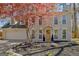 Charming two-story home featuring a brick facade, attached garage, and mature landscaping at 104 Pine Pt, Peachtree City, GA 30269