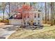 Charming two-story home featuring a brick facade, attached garage, and mature landscaping at 104 Pine Pt, Peachtree City, GA 30269