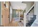Entry foyer of a home featuring stairs and a dining room at 104 Pine Pt, Peachtree City, GA 30269