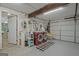 Garage featuring modern washer, dryer, checkerboard mat, and entry door at 104 Pine Pt, Peachtree City, GA 30269