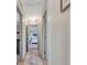 Hallway view of a light and airy home, with several rooms visible at 104 Pine Pt, Peachtree City, GA 30269