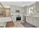 Bright eat-in kitchen featuring stainless appliances, light-colored cabinetry, and a modern countertop at 104 Pine Pt, Peachtree City, GA 30269