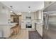 Modern kitchen with stainless steel appliances, and a breakfast bar, ideal for casual dining and gatherings at 104 Pine Pt, Peachtree City, GA 30269