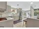 Bright kitchen with modern appliances, stylish backsplash, and an open layout perfect for cooking and entertaining at 104 Pine Pt, Peachtree City, GA 30269