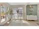 Sunlit living area with French doors leading to the outdoors, perfect for enjoying the beautiful views and fresh air at 104 Pine Pt, Peachtree City, GA 30269