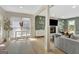 Open living space with abundant natural light, modern furnishings, and a view of the cozy fireplace at 104 Pine Pt, Peachtree City, GA 30269
