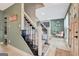 Carpeted staircase leading to the second floor, with views of the living area with fireplace at 104 Pine Pt, Peachtree City, GA 30269