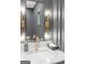 Modern bathroom with gray walls, marble countertop and elegant light fixtures at 265 High St, Fayetteville, GA 30214