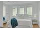 Bright bedroom featuring large windows and a comfortable king-sized bed at 265 High St, Fayetteville, GA 30214