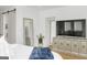 Bright bedroom featuring a large TV, light wood floors and a large mirror at 265 High St, Fayetteville, GA 30214