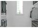 Walk-in closet features a window and plenty of space for hanging and folded items at 265 High St, Fayetteville, GA 30214