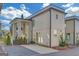 Modern two-story home with light beige siding, dark trim, a small yard, and a private driveway at 265 High St, Fayetteville, GA 30214