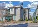 Modern two-story home with gray siding, a small front yard, and stone walkway under a partly cloudy sky at 265 High St, Fayetteville, GA 30214