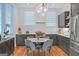 Bright eat-in kitchen boasts stainless steel appliances, and a stylish light fixture at 265 High St, Fayetteville, GA 30214