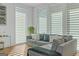 Bright living room with large windows, a comfortable sofa, and contemporary decor at 265 High St, Fayetteville, GA 30214
