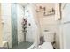 Updated bathroom features a tiled shower with glass door and modern fixtures and shelving at 3685 Concordia Rd, Decatur, GA 30034