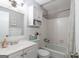 Cozy bathroom with vanity sink, tiled floors, bathtub, and shower with a curtain at 3685 Concordia Rd, Decatur, GA 30034