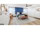 Stylish bedroom with blue accent wall, ceiling fan and bright natural lighting at 3685 Concordia Rd, Decatur, GA 30034