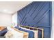 Detailed view of a blue accent wall and headboard in a home bedroom at 3685 Concordia Rd, Decatur, GA 30034