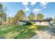 Sprawling ranch home with a well-manicured lawn and mature trees providing privacy at 3685 Concordia Rd, Decatur, GA 30034