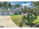 Ranch-style home with mature trees, an attached garage, and a well-maintained lawn at 3685 Concordia Rd, Decatur, GA 30034