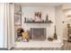 Cozy brick fireplace with decorative items and hearth, perfect for relaxation at 3685 Concordia Rd, Decatur, GA 30034