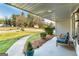 Charming covered front porch with seating, potted plants, and a serene outdoor view at 3685 Concordia Rd, Decatur, GA 30034