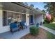 Welcoming front porch with blue chairs, front door and manicured landscaping enhancing curb appeal at 3685 Concordia Rd, Decatur, GA 30034