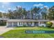 Charming renovated single-story home boasts a manicured lawn and inviting curb appeal at 3685 Concordia Rd, Decatur, GA 30034