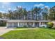 Charming renovated single-story home boasts a manicured lawn and inviting curb appeal at 3685 Concordia Rd, Decatur, GA 30034