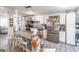 Modern kitchen with white cabinets, granite counters, stainless steel appliances, and large island at 3685 Concordia Rd, Decatur, GA 30034