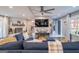 Spacious living room with grey flooring, stylish decor, and brick fireplace at 3685 Concordia Rd, Decatur, GA 30034