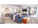 Spacious living room with grey flooring, stylish decor, and modern ceiling fan at 3685 Concordia Rd, Decatur, GA 30034