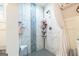 Walk in shower with white marble, gray accent, and chrome fixtures at 3685 Concordia Rd, Decatur, GA 30034