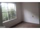 Bright bedroom featuring natural light from a window, carpeted flooring at 50 Village Walk, Covington, GA 30016