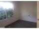 Bedroom with a window and neutral carpet at 50 Village Walk, Covington, GA 30016