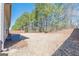 Large backyard featuring a well-maintained lawn, bordered by a privacy fence and mature trees, perfect for outdoor activities at 4050 Villagewood Ln, Ellenwood, GA 30294