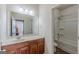 Bathroom features a modern vanity with an expansive mirror and combined tub and shower at 4050 Villagewood Ln, Ellenwood, GA 30294