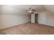 A carpeted attic bonus room with multiple doors and utility access at 4050 Villagewood Ln, Ellenwood, GA 30294