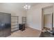 Bedroom featuring neutral walls, carpet, lighting fixture, and shelving units at 4050 Villagewood Ln, Ellenwood, GA 30294
