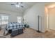 Bedroom with vaulted ceiling, ceiling fan, natural light, and carpeted flooring at 4050 Villagewood Ln, Ellenwood, GA 30294