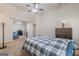 Comfortable bedroom featuring a ceiling fan, natural light, and neutral tones at 4050 Villagewood Ln, Ellenwood, GA 30294