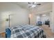 Spacious bedroom featuring a ceiling fan and access to a sitting room through an archway at 4050 Villagewood Ln, Ellenwood, GA 30294