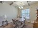 Dining room featuring coffered ceilings, large window with natural light and neutral walls at 4050 Villagewood Ln, Ellenwood, GA 30294