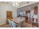 Open-concept dining room with coffered ceilings flows into a kitchen and living area at 4050 Villagewood Ln, Ellenwood, GA 30294